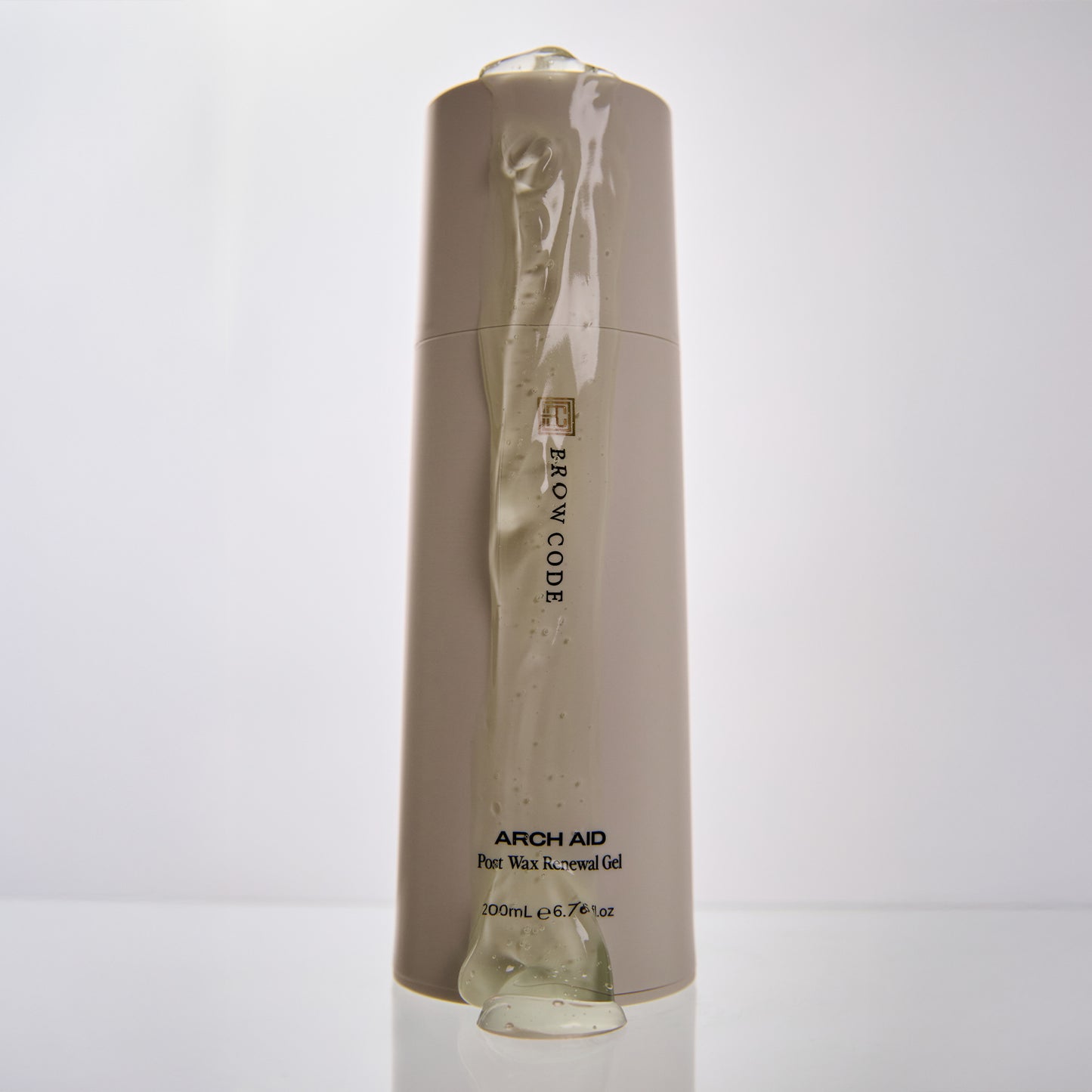 Brow Code Arch Aid Post Wax Renewal Gel bottle with clear gel dripping down