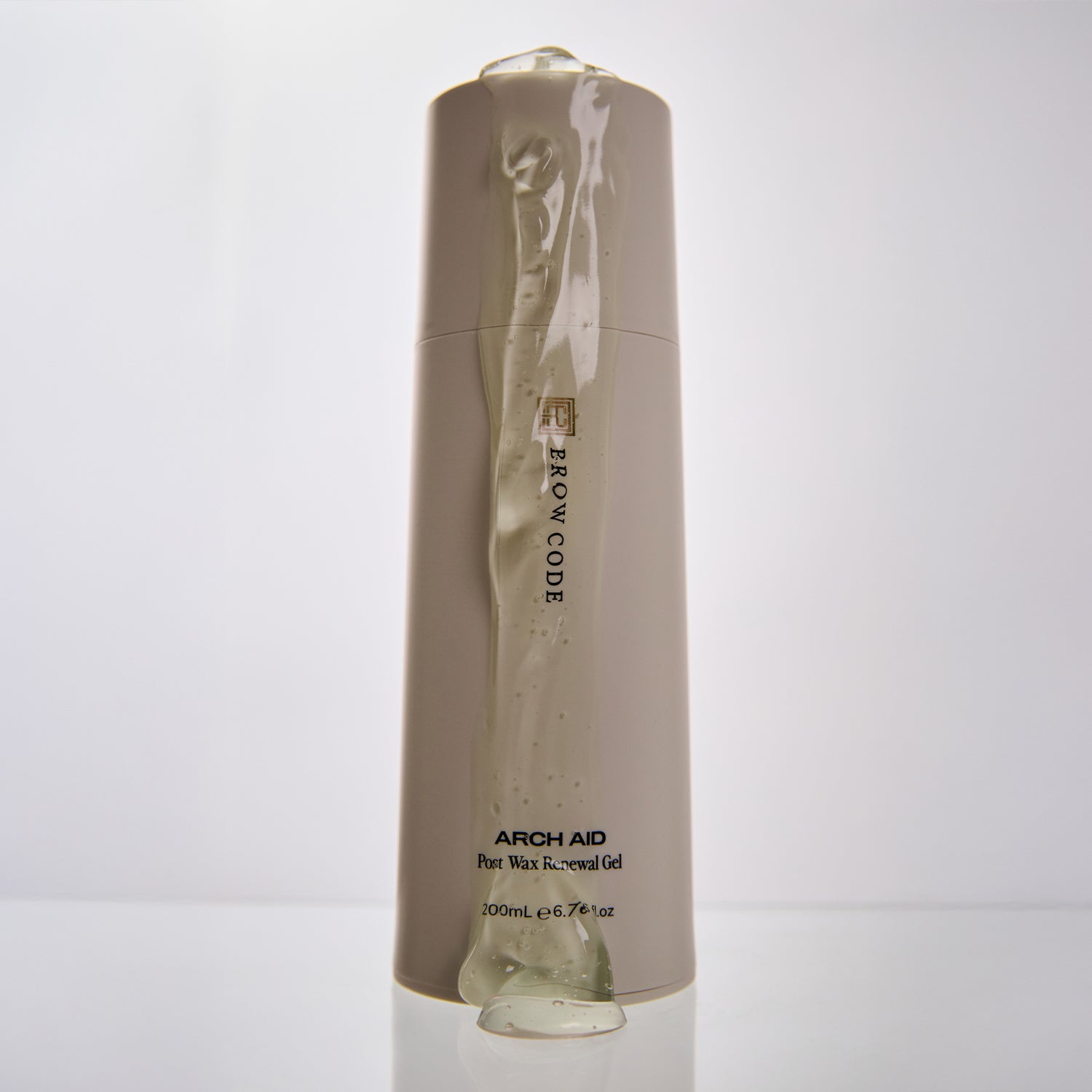 Brow Code Arch Aid Post Wax Renewal Gel bottle with clear gel dripping down